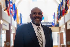 Dr. Marvin Crumbs at grand staircase at mhs