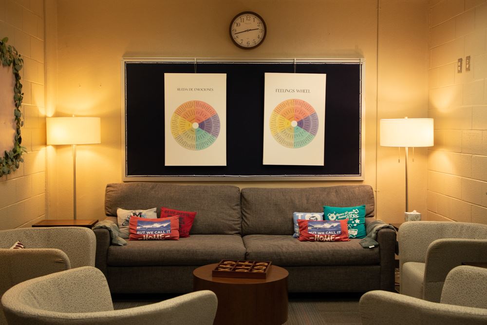 Low-lit room with couch and lamps