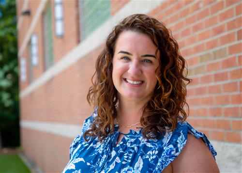 Dr. Jillian Johnson in front of a brick wall