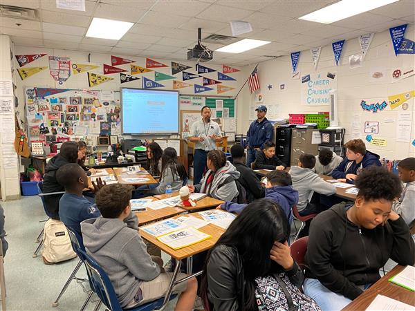 Wide view of students and adults in classroom