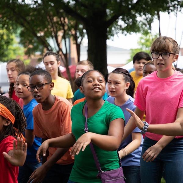 Group of students outside in colorful shirts