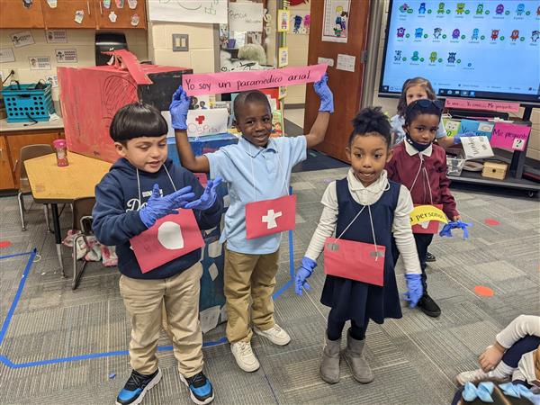 Children practice talking about professions in Spanish
