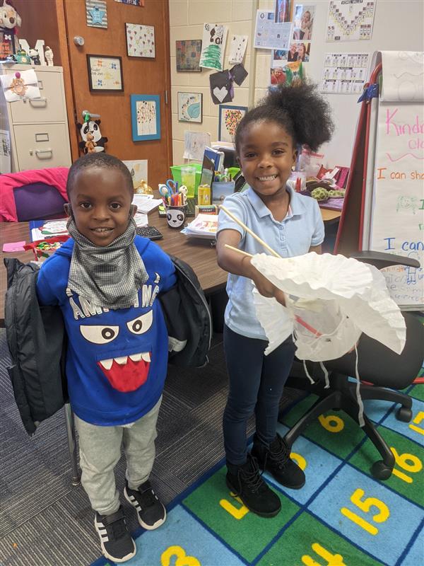 Two students smiling in the classroom