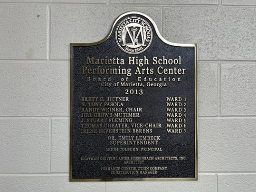 Board of Education plaque listing board members: Brett C. Bittner of Ward 1; N. Tony Fasola of Ward 2; Randy Weiner, Chair and Ward 3; Jill Crowe Mutimer of Ward 4; J. Stuart Fleming of Ward 5; Thomas Cheater, Vice-Chair and Ward 6; and Irene Beverstein Berens of Ward 7; as well as Dr. Emily Lembeck