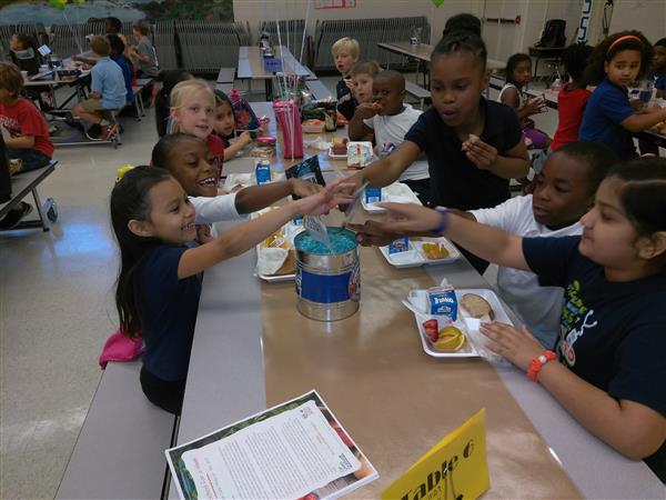 Students enjoying lunch together in a school cafeteria